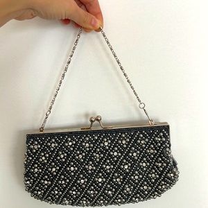 Sparkly clutch purse. With silk inside and a small side pocket. No brand name.